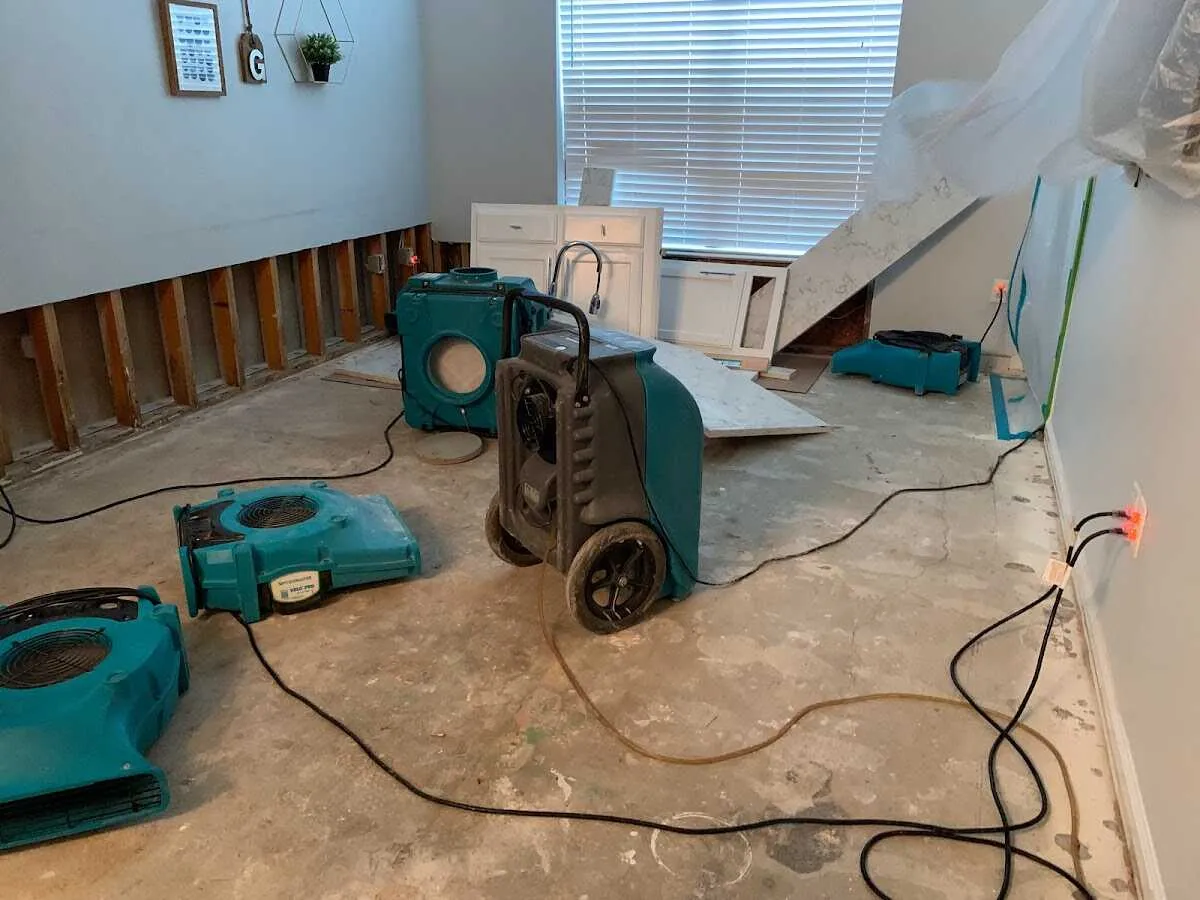 Dehumidifier in flood-cut room for Water Damage Restoration in Springville